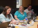 Jackie Blumer, KC9LEH, center, smiles during the ARRL Teachers Institute on Wireless Technology